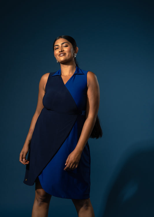 Woman wearing a two toned blue dress for casual wear.