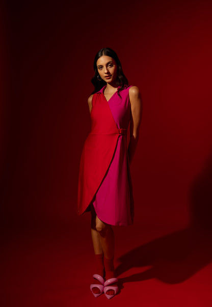 Woman wearing a pink dress against a red background