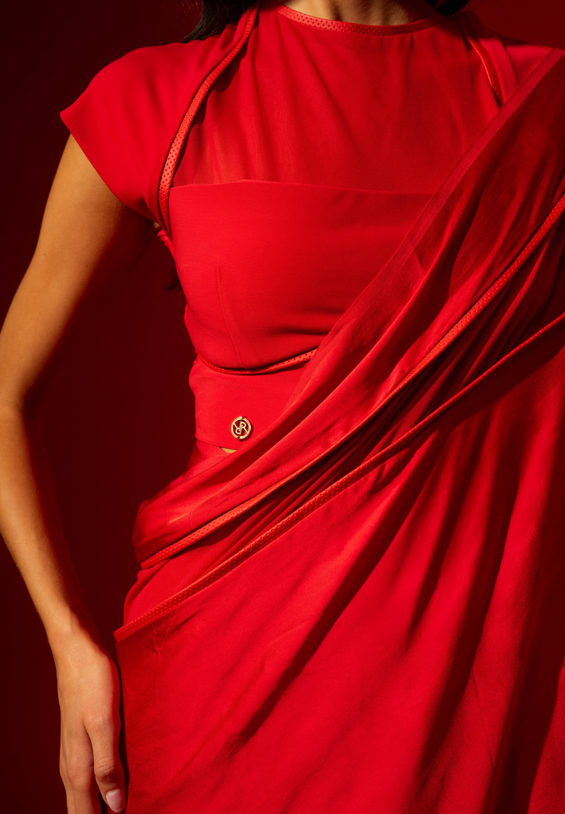 Woman in Rebel Roots Capsule Pre-stitched Red Saree with Blouse. 